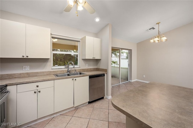 kitchen featuring a wealth of natural light, sink, stainless steel appliances, and lofted ceiling