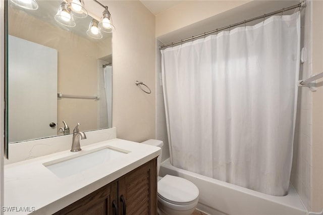 full bathroom with vanity, shower / tub combo, and toilet