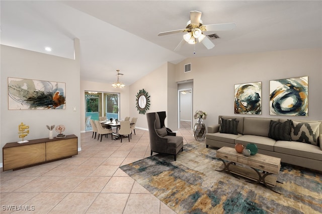 tiled living room with ceiling fan with notable chandelier and vaulted ceiling