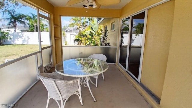 sunroom / solarium with ceiling fan