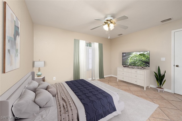 tiled bedroom with ceiling fan