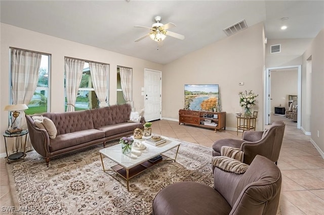 living area with lofted ceiling, light tile patterned floors, ceiling fan, and visible vents