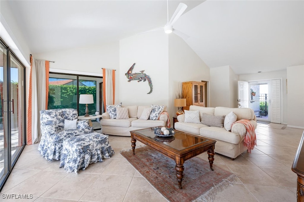 tiled living room featuring high vaulted ceiling, ceiling fan, and a wealth of natural light