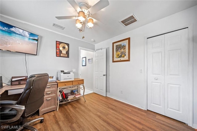 office area with ceiling fan and light hardwood / wood-style flooring