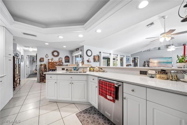 kitchen with white cabinetry, sink, ceiling fan, stainless steel dishwasher, and light tile patterned flooring