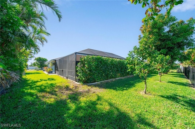 view of yard with a lanai