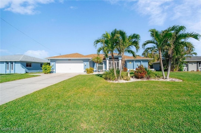 ranch-style house featuring a front yard and a garage