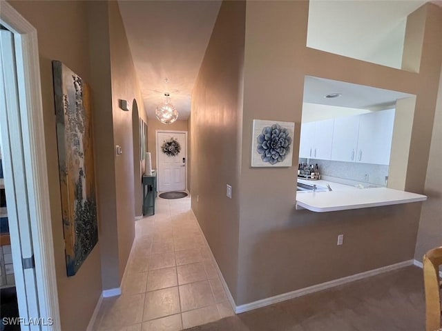 hallway with light tile patterned flooring