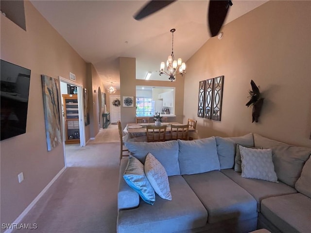 living room featuring a notable chandelier, light carpet, and lofted ceiling