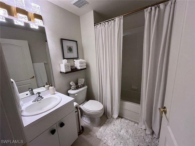 full bathroom with shower / bath combo with shower curtain, toilet, tile patterned floors, and vanity