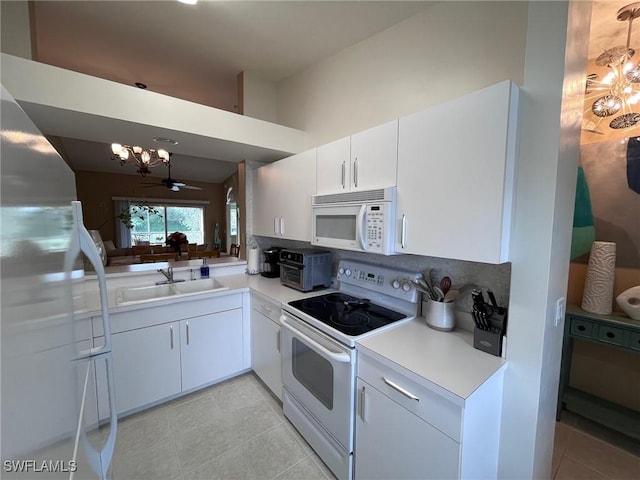 kitchen featuring ceiling fan, sink, white cabinets, tasteful backsplash, and white appliances