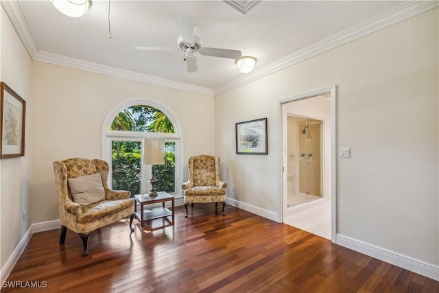 living area featuring dark hardwood / wood-style floors, ceiling fan, and ornamental molding