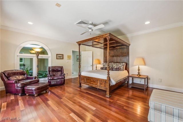 bedroom with hardwood / wood-style floors, ceiling fan, and crown molding