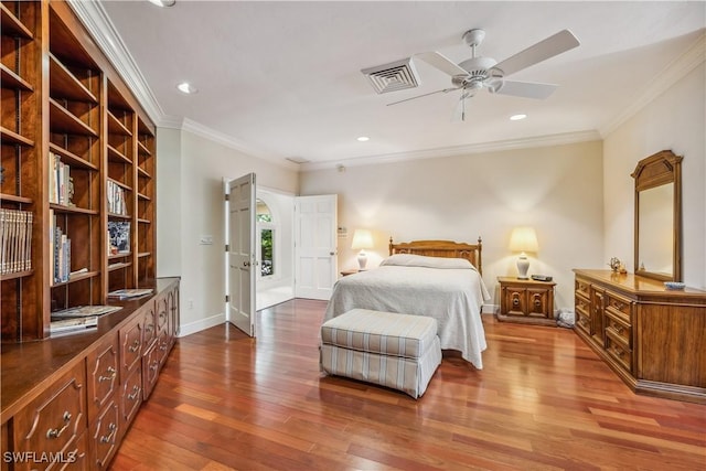 bedroom with ceiling fan, wood-type flooring, and ornamental molding