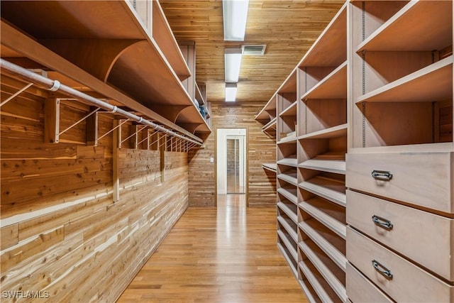 spacious closet featuring light wood-type flooring