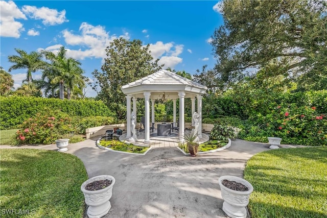 view of community with a lawn and a gazebo