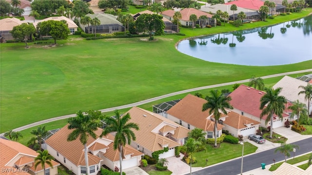 drone / aerial view with a water view