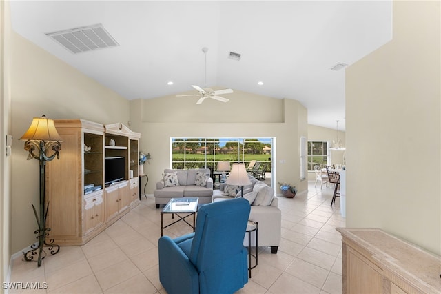 tiled living room with ceiling fan and lofted ceiling