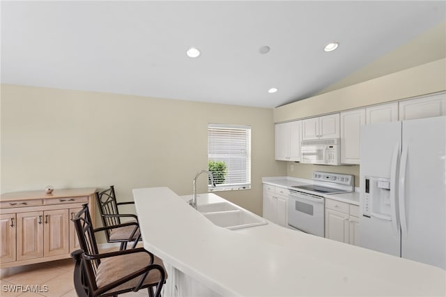 kitchen featuring white appliances, white cabinetry, and sink