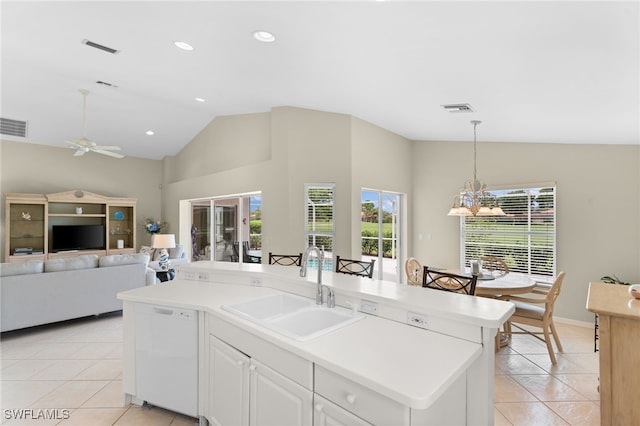 kitchen with dishwasher, a center island with sink, ceiling fan with notable chandelier, sink, and white cabinetry