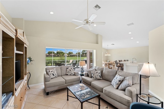 tiled living room featuring high vaulted ceiling and ceiling fan