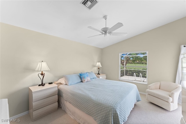 carpeted bedroom featuring vaulted ceiling and ceiling fan