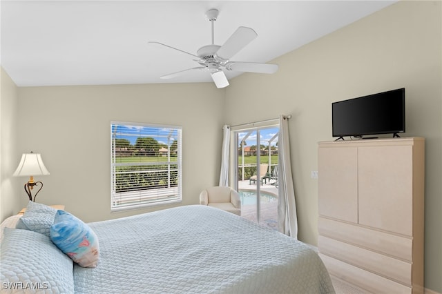 bedroom with ceiling fan, access to exterior, and lofted ceiling