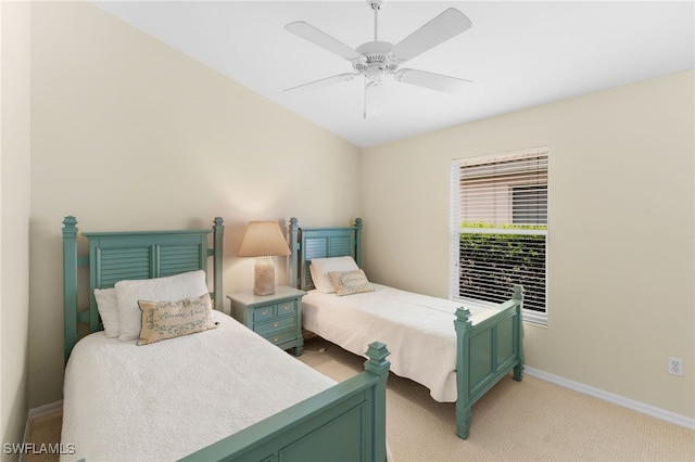 bedroom featuring light carpet and ceiling fan