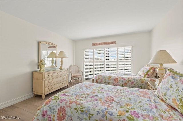 bedroom with light wood-type flooring