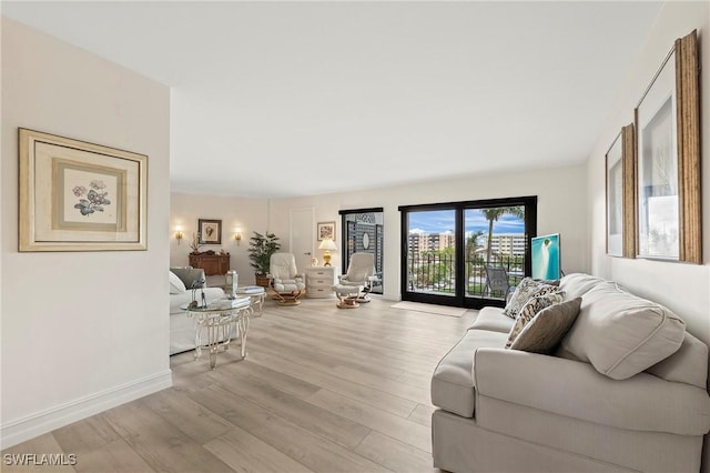 living room with light hardwood / wood-style flooring