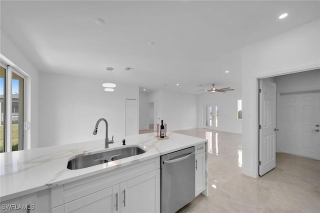 kitchen with stainless steel dishwasher, ceiling fan, sink, white cabinetry, and hanging light fixtures