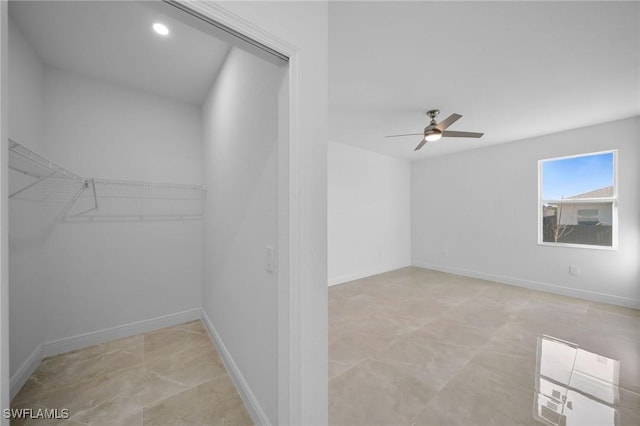 spacious closet featuring ceiling fan