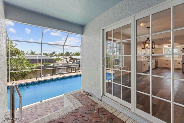 view of swimming pool with sink