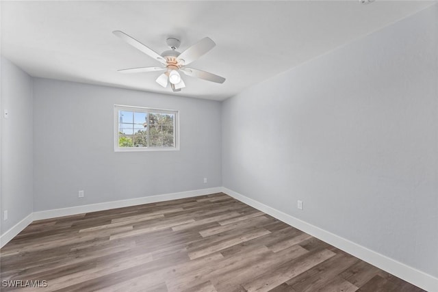 empty room featuring ceiling fan and wood-type flooring