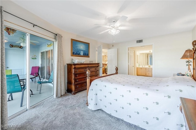 carpeted bedroom featuring access to exterior, ceiling fan, and ensuite bath