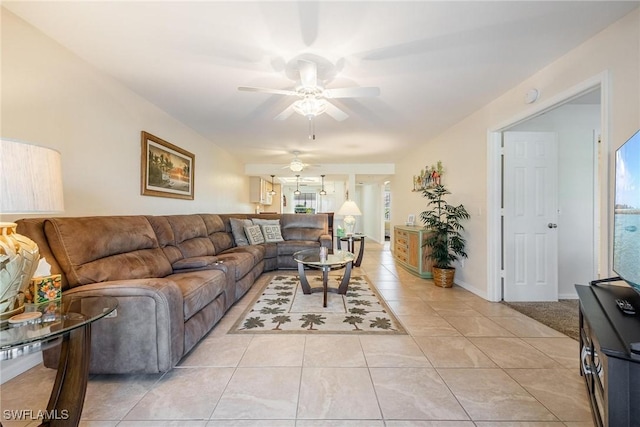 tiled living room with ceiling fan