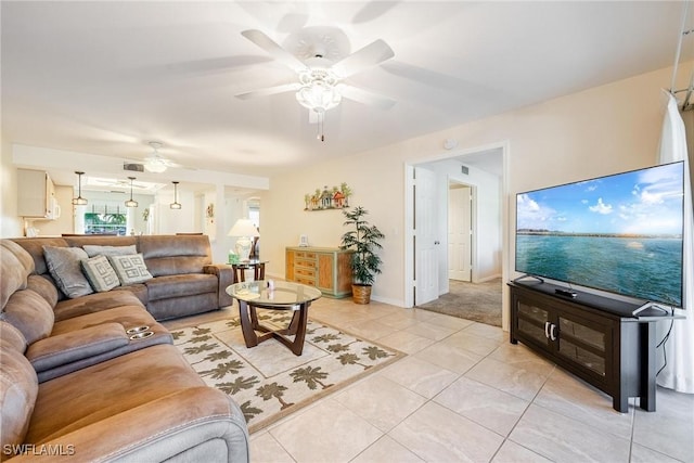 tiled living room featuring ceiling fan