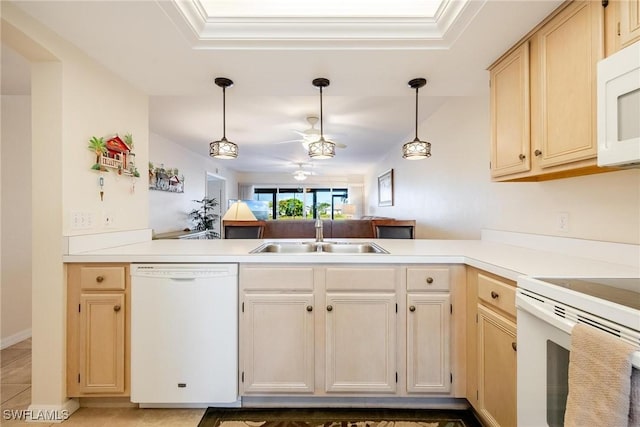 kitchen with kitchen peninsula, white appliances, ceiling fan, sink, and pendant lighting