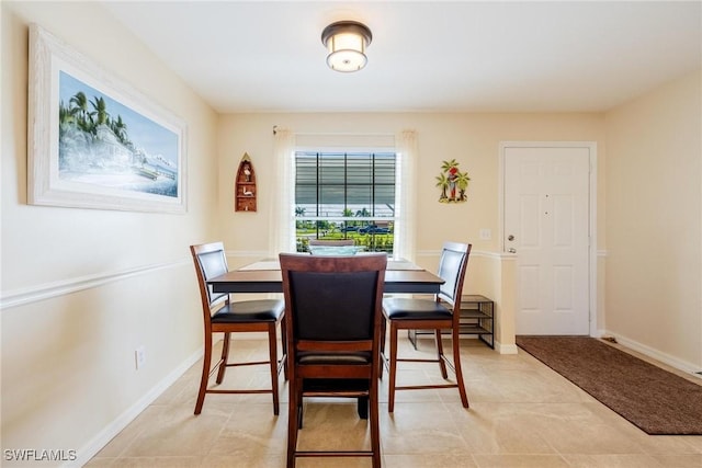 dining space with light tile patterned floors