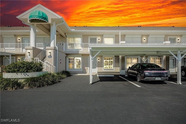 view of outdoor building at dusk