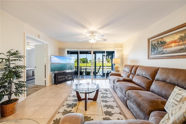 tiled living room featuring ceiling fan