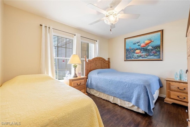 bedroom featuring ceiling fan and dark wood-type flooring