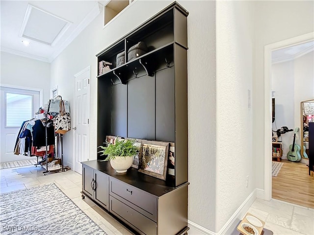 mudroom with crown molding and light wood-type flooring