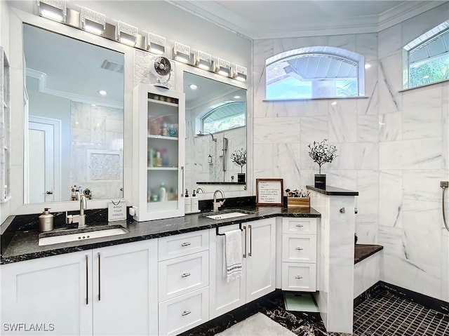 bathroom with walk in shower, plenty of natural light, and ornamental molding