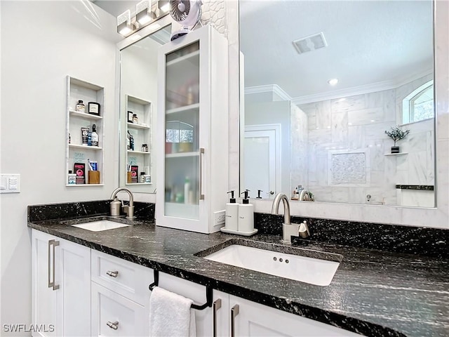 bathroom featuring vanity and ornamental molding