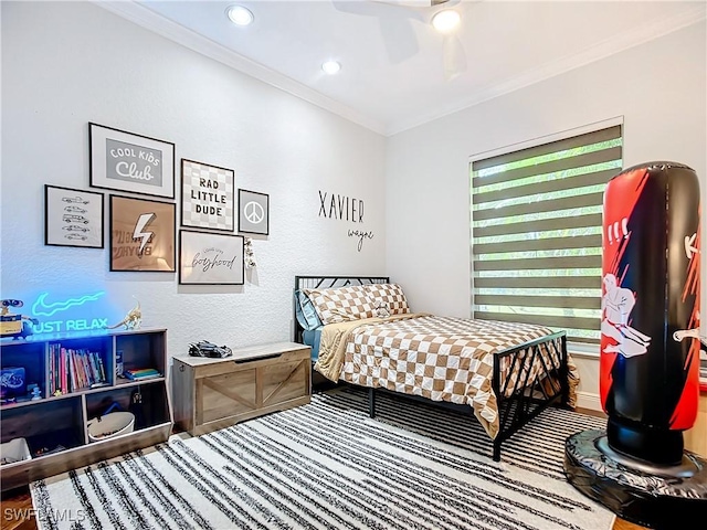 bedroom with ceiling fan and ornamental molding