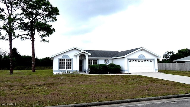 ranch-style home with a garage and a front yard