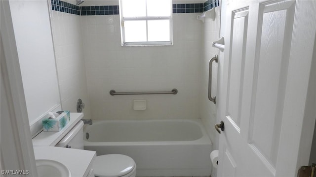 full bathroom featuring vanity, toilet, and tiled shower / bath