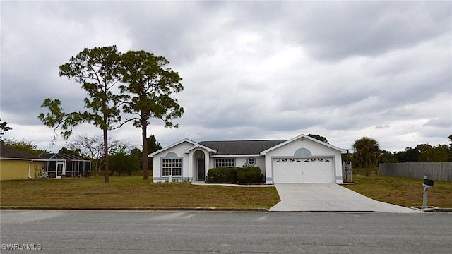 single story home with a front yard and a garage