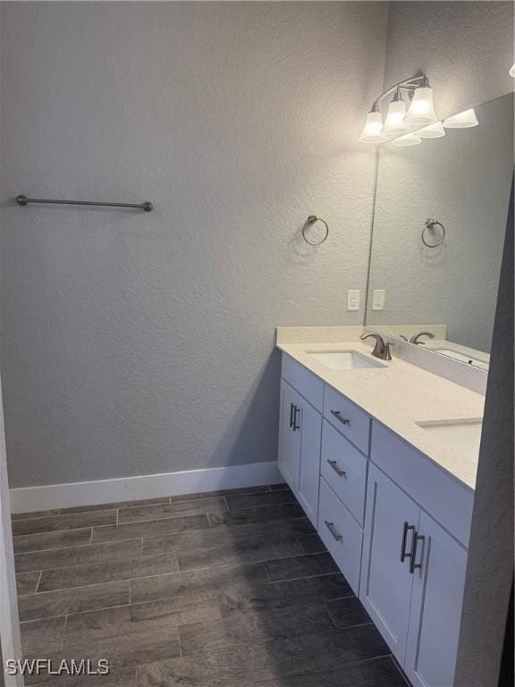 bathroom with hardwood / wood-style floors and vanity